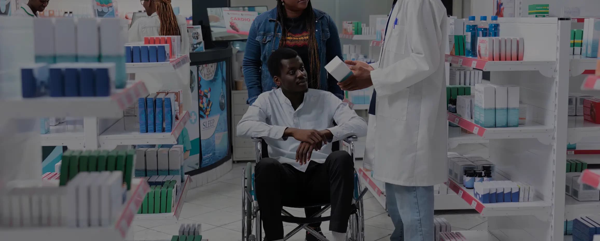 Man on wheelchair with worker